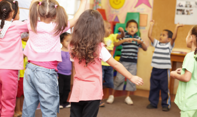 children dancing in a circle